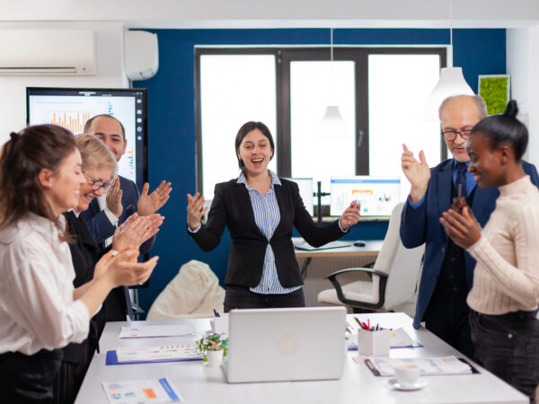 Motivated happy diverse business team people clapping